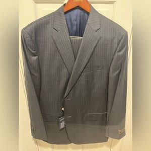 Never worn 46R US Cremieux charcoal pinstripe suit. Unhemmed pants